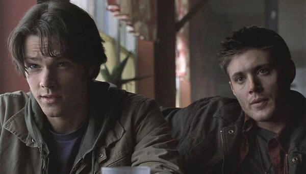 Picture of Sam and Dean Winchester from Supernatural at a cafe(?)