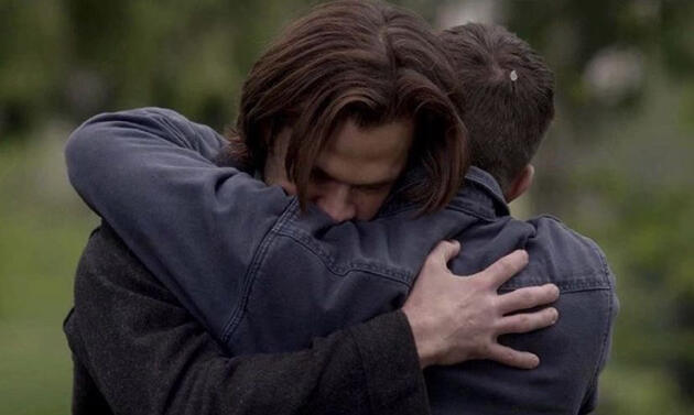 Picture of Sam and Dean Winchester from Supernatural hugging